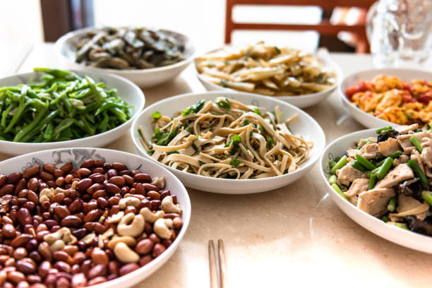Person enjoying a varied homemade lunch at a bright table